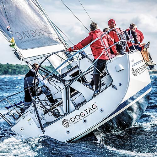 a group sailing the dogtag boat